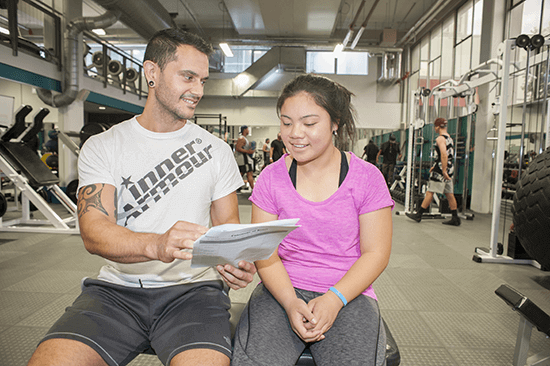 Student with gym instructor